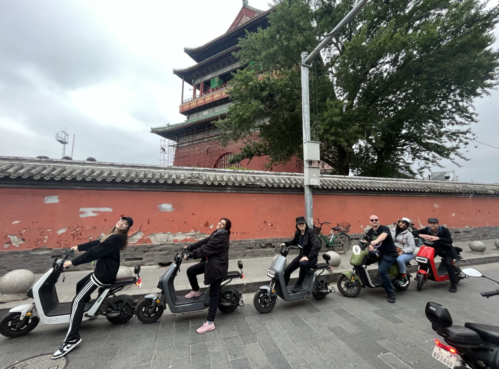 Our Beijing Clients having a perfect cycling tour of hidden Beijing riding electric scooters