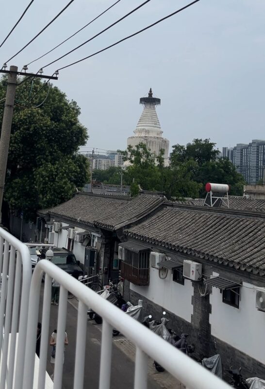 View of White Pagoda from a hidden hutong café — perfect for a peaceful Beijing weekend.