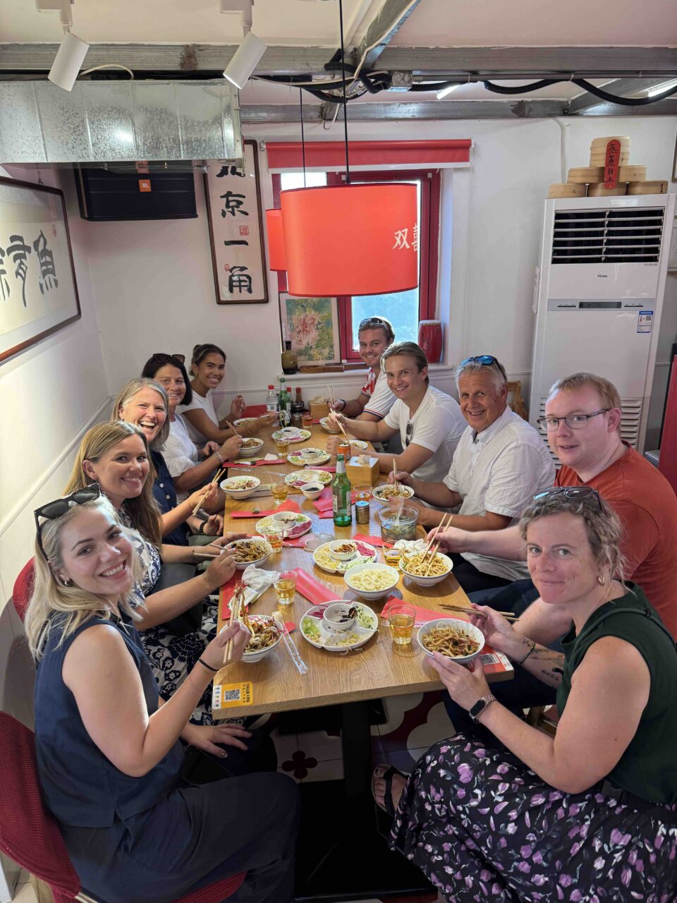 Close-up of traditional Beijing food shared around a table — local time in Beijing captured in taste and togetherness.