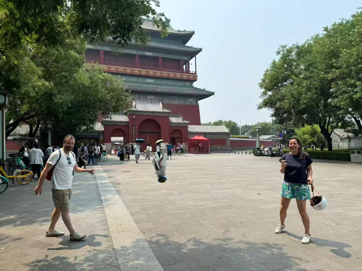 Guests playing Jianzi shuttlecock game in a Beijing hutong – a quintessential Beijing local experience